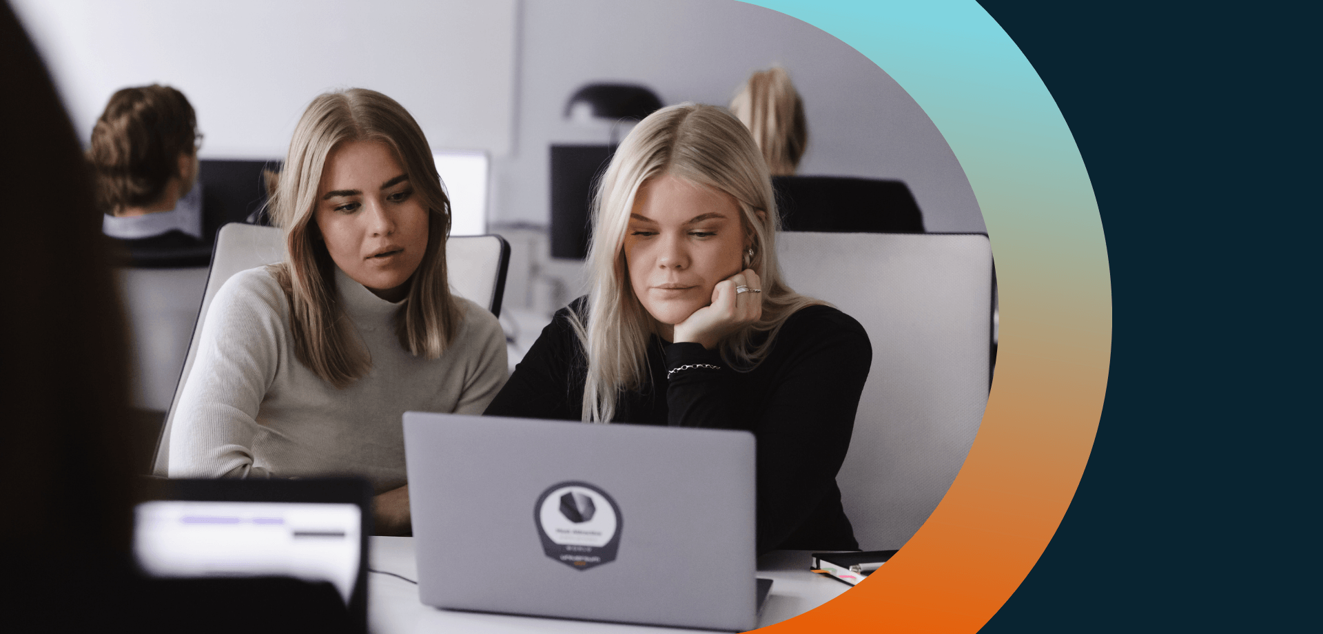 Two girls looking at a computer screen